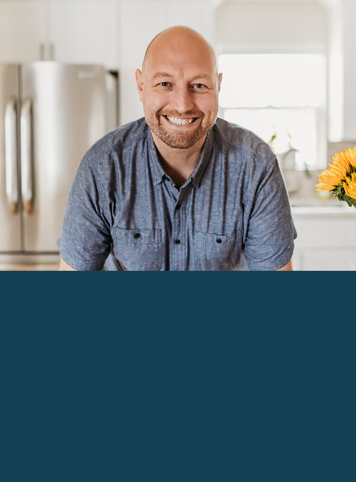 Headshot image in a kitchen of SSeaBear Ambassador, Reed Dunn of Pesto & Potatoes | SeaBear Smokehouse