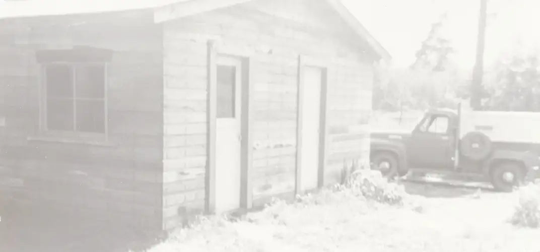 Sepia toned photograph of old smoke house