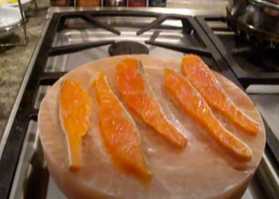 Searing Wild Salmon On a Heated Himalayan Pink Sea Salt Plank