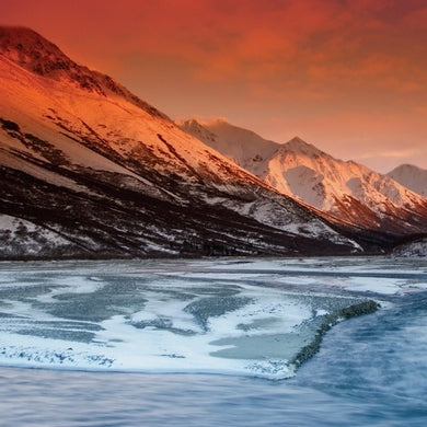 Scenic photo of Alaska, featuring Copper River and a bright orange horizon | Fresh & Wild | SeaBear Smokehouse