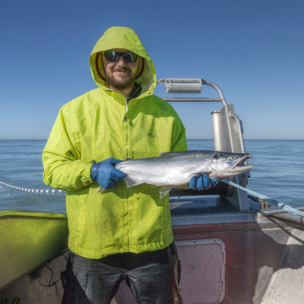 John Weise Holding A Salmon | Fresh & Wild | SeaBear Smokehouse