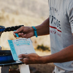 Man holding a ready to eat salmon pouch outside