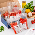 SeaBear | Box of sockeye salmon dinner fillets sealed in preserving packaging.