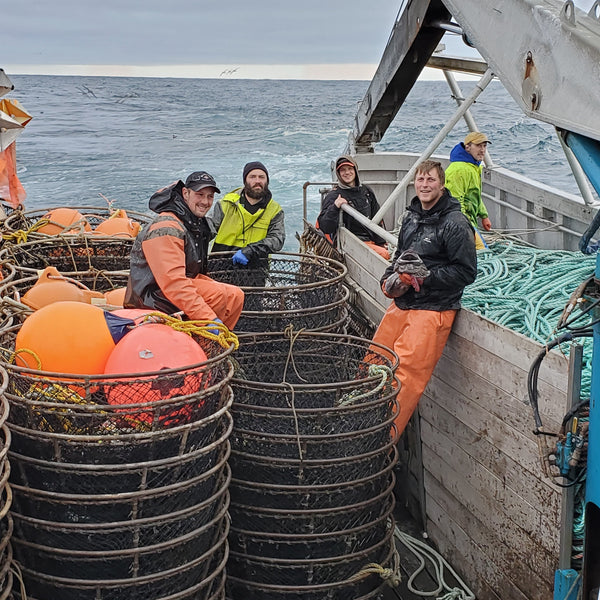 Fishermen Gathered Around a Fishing Vessel with Nets | Fresh & Wild | SeaBear Smokehouse