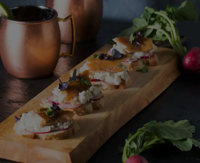 charcuterie board with smoked salmon lox and Moscow mules