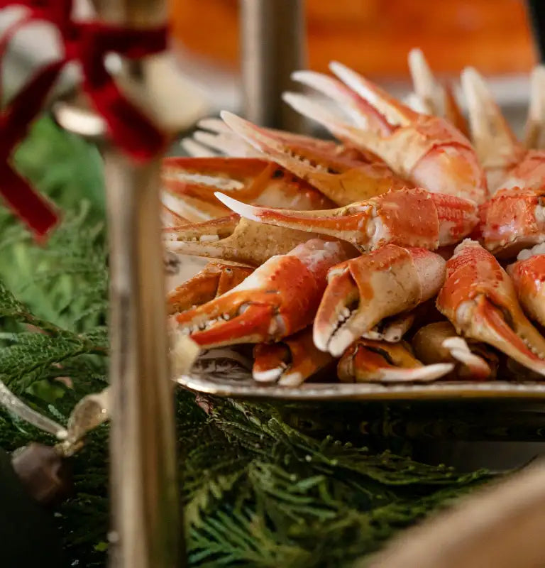 Snow crab claws festively laid out on a holiday spread